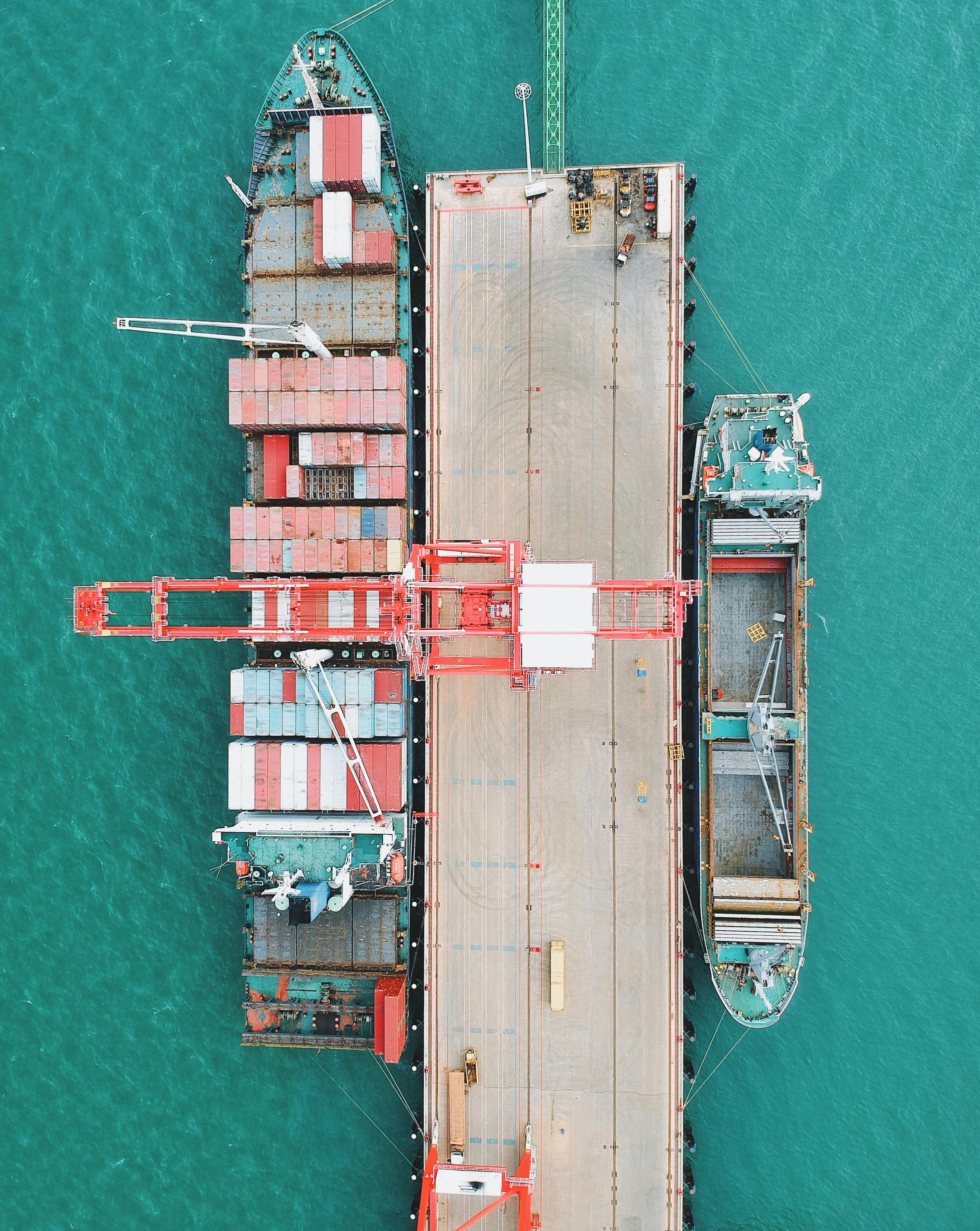 A Cargo Ship Containers Docked on a Pier