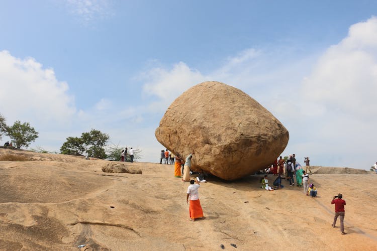 Tourist People Sightseeing On Krishna Butter Ball In India