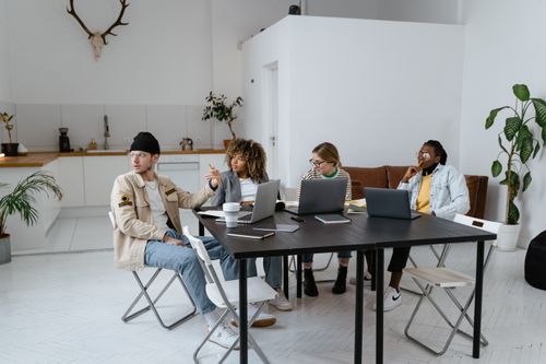 Free A diverse group of professionals collaborating in a modern and stylish office setting. Stock Photo