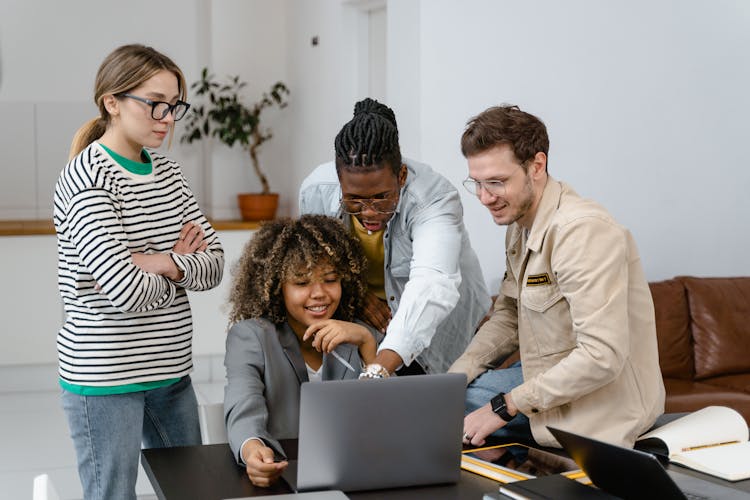 Colleagues Brainstorming A Business Project At A Meeting