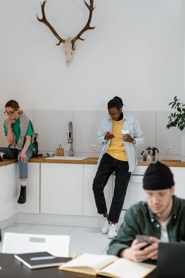 People In The Office Having A Break At The Kitchen Area