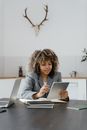 Woman in Gray Long Sleeve Shirt Using Macbook Pro