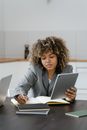Woman in Gray Blazer Using Macbook