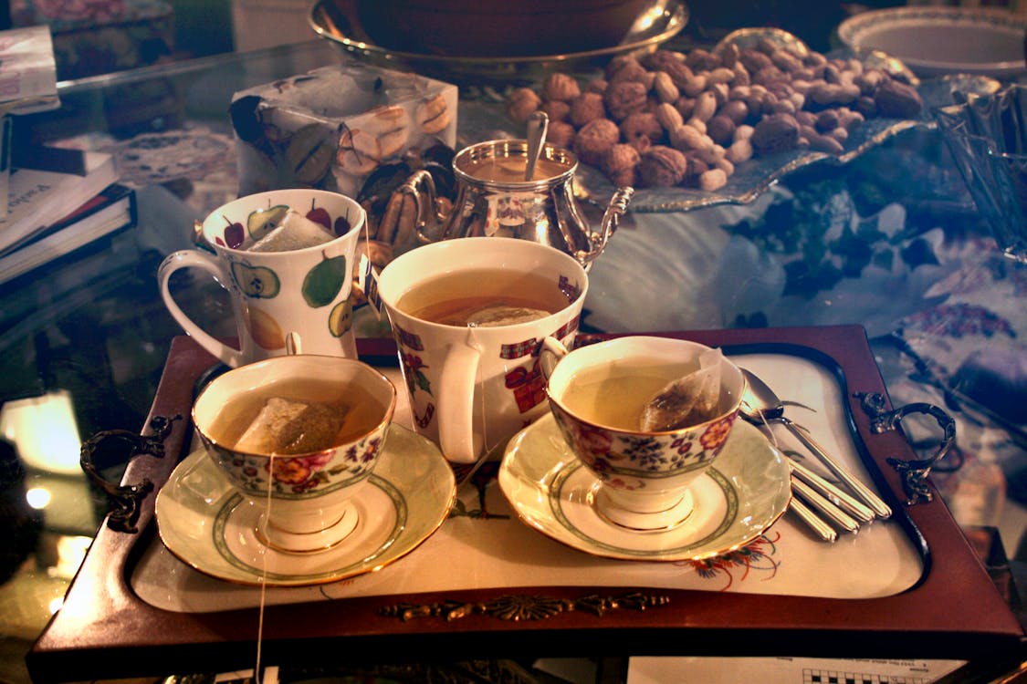 Free Three Cups of Teas on Serving Tray Stock Photo