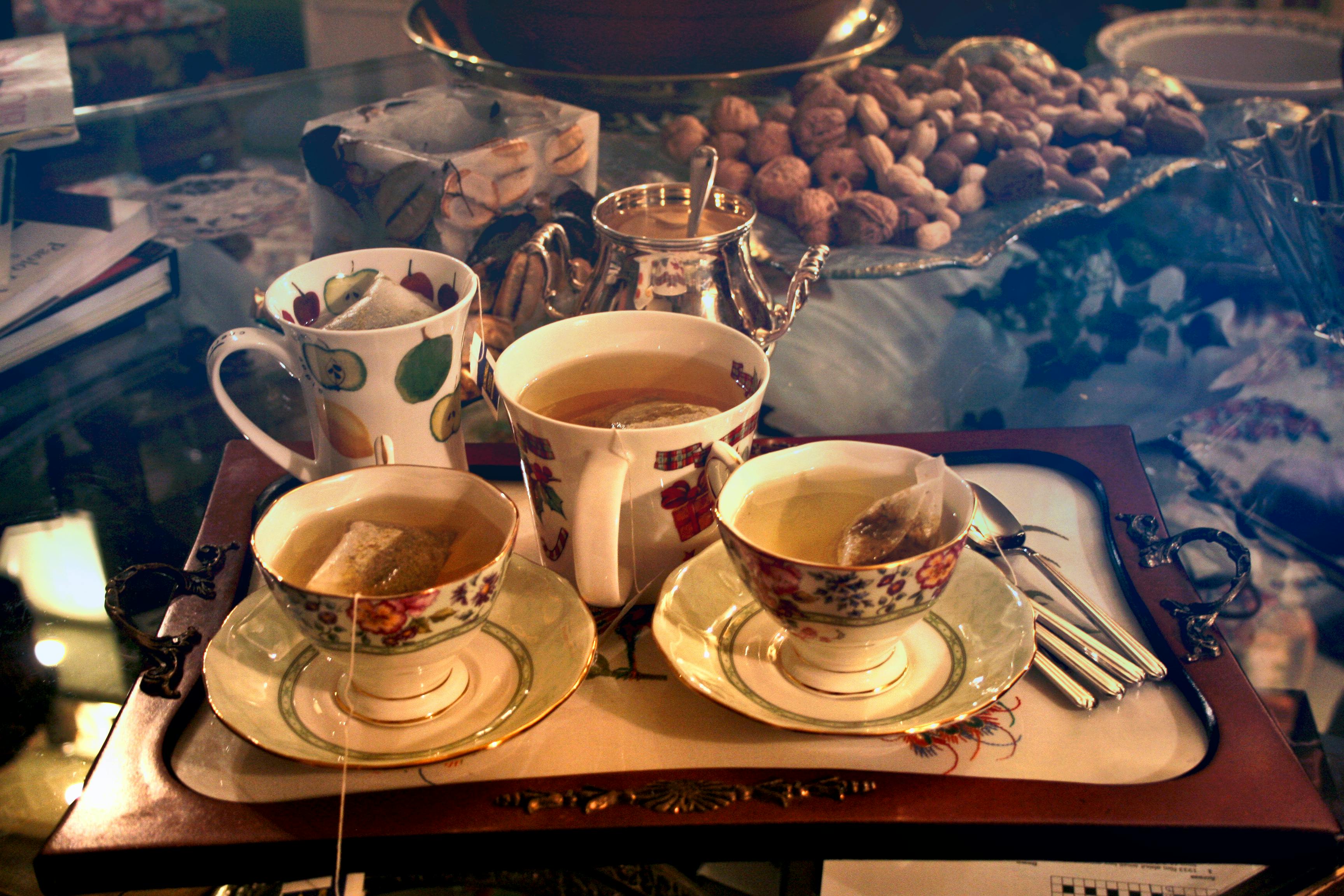 Orange tea kettle with a hot drink. Photo manipulation Stock Illustration