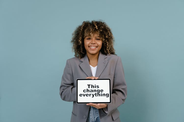 Smiling Woman In Gray Blazer 