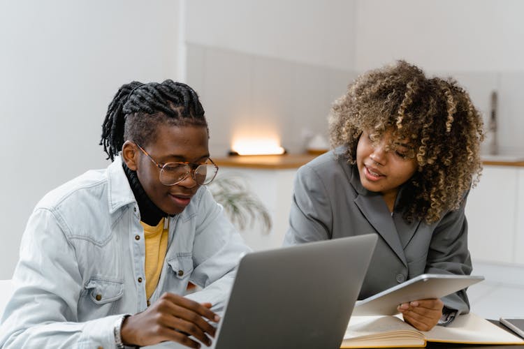 A Woman And A Man Working Together