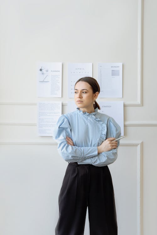 Free Woman in Blue Long Sleeve Shirt Looking Sideways Stock Photo