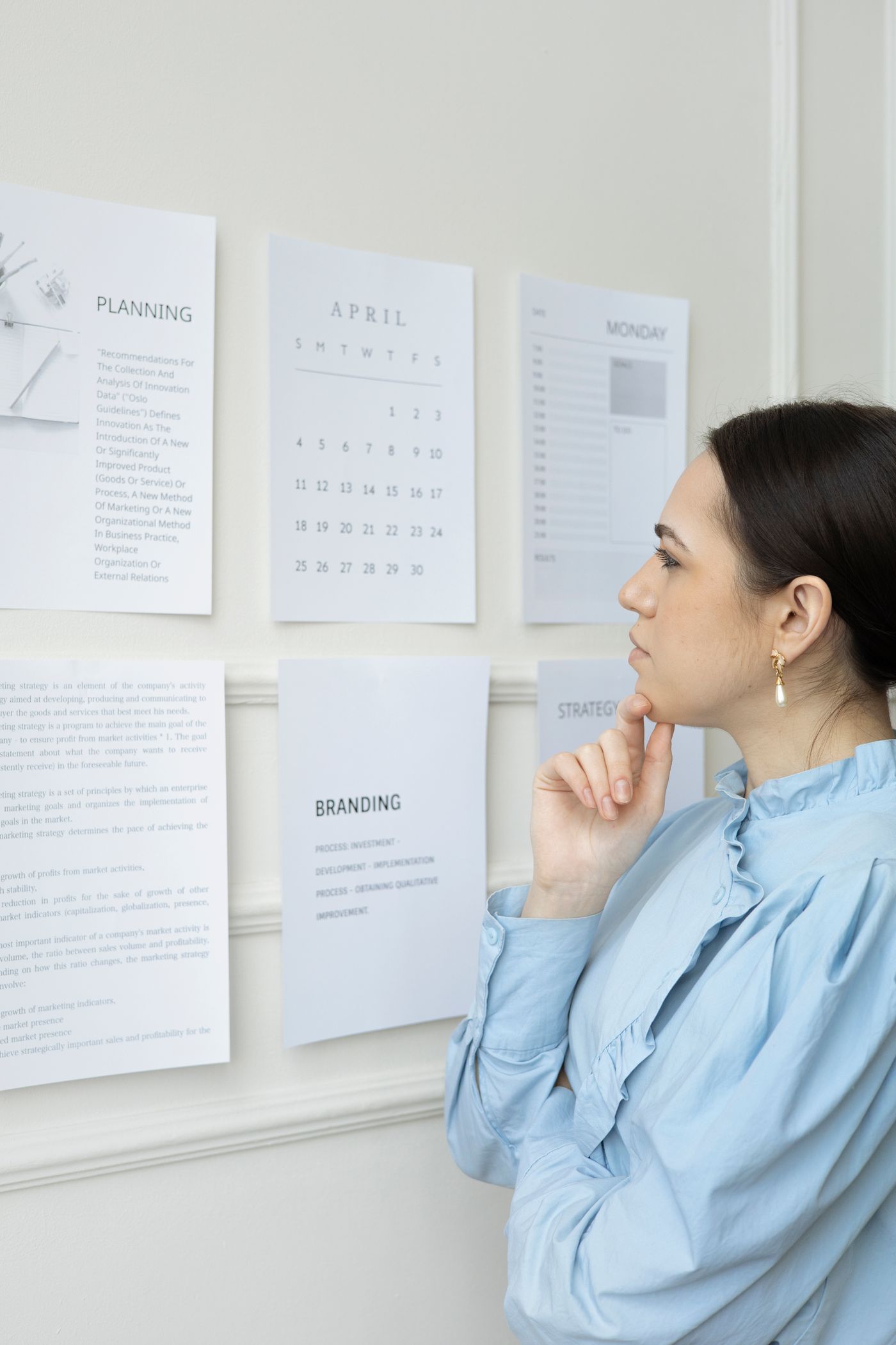 Planning on an office wall of papers — the five-year cost of ICPCAS accreditation is shown on every tier.