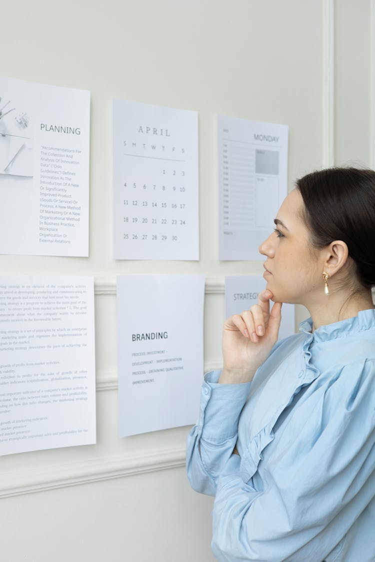 A Woman Thinking While Looking At Paper