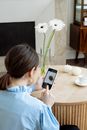 Woman in White Shirt Holding Silver Iphone 6