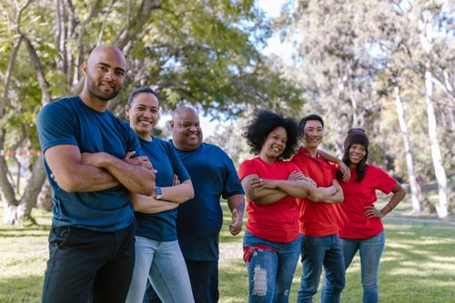 Free Diverse group of adults bonding and enjoying team activity in a park. Stock Photo