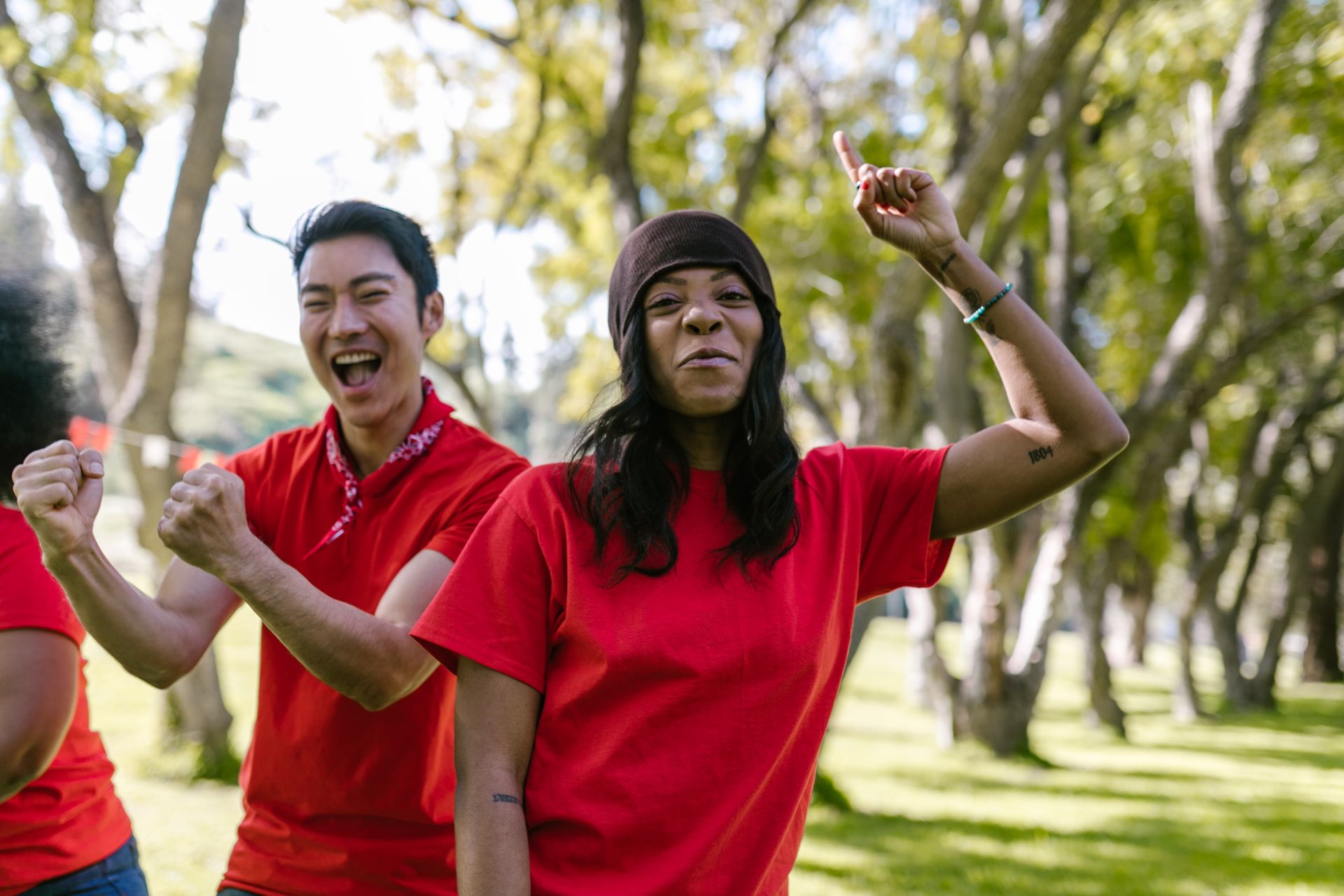 A lively outdoor team building session with diverse adults engaging in activities.