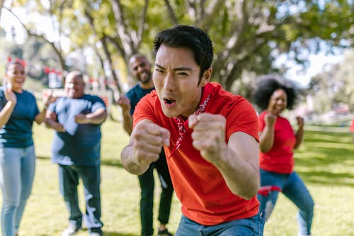 Man In Red Shirt With A Funny Facial Expression