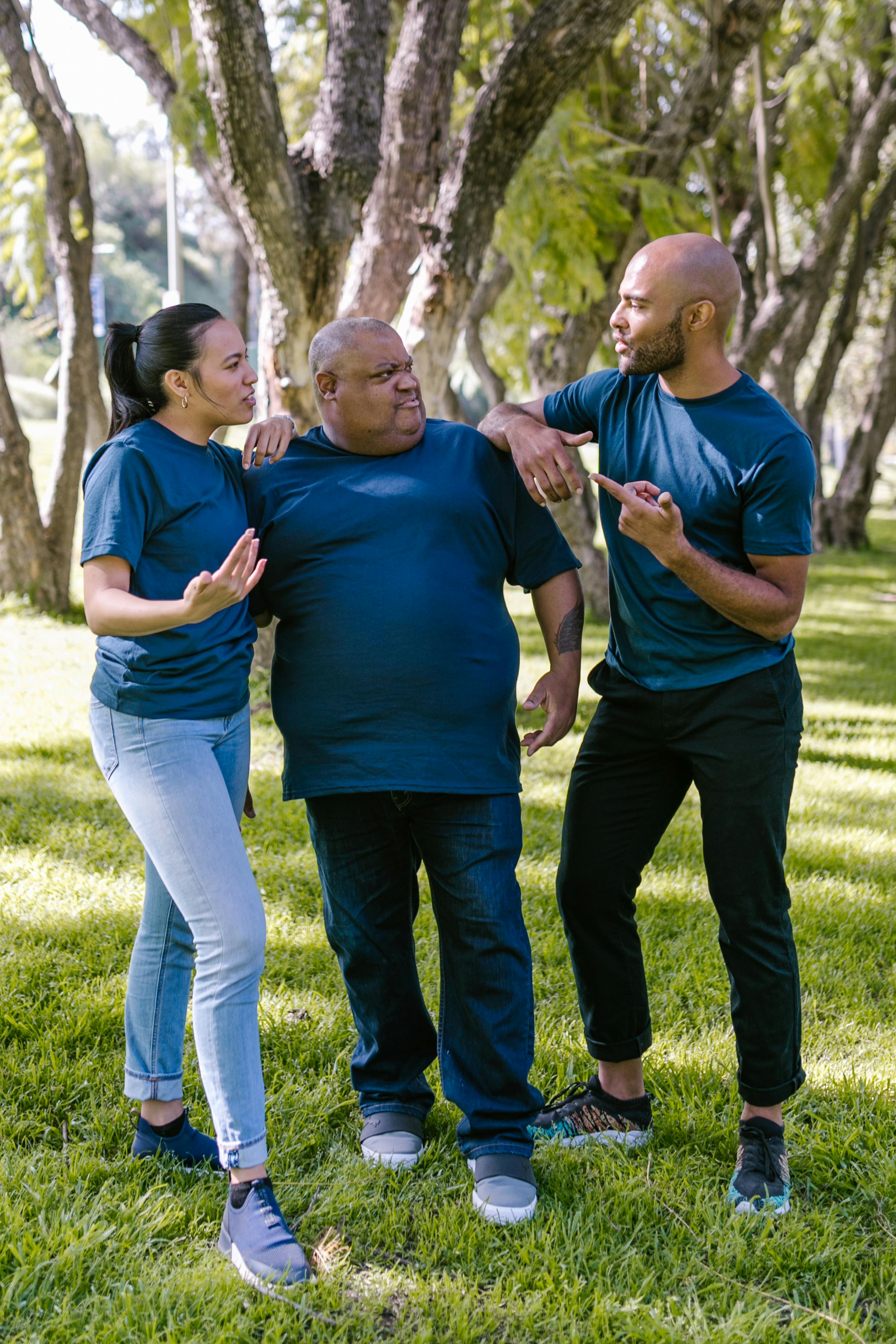 people standing near a tree