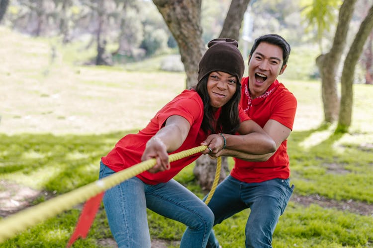 Man And Woman Playing Tug-of-war