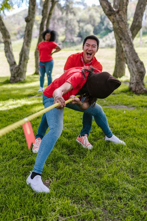 Man And Woman Playing Tug-of-war