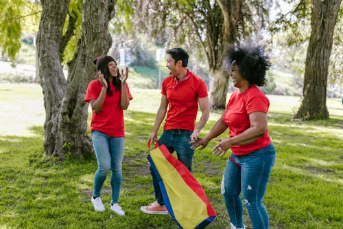 People In Red Crew Neck Shirts Having Fun 