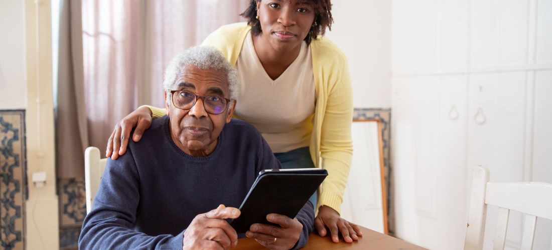 Senior couple enjoying a relaxed moment in a bright, comfortable assisted living apartment