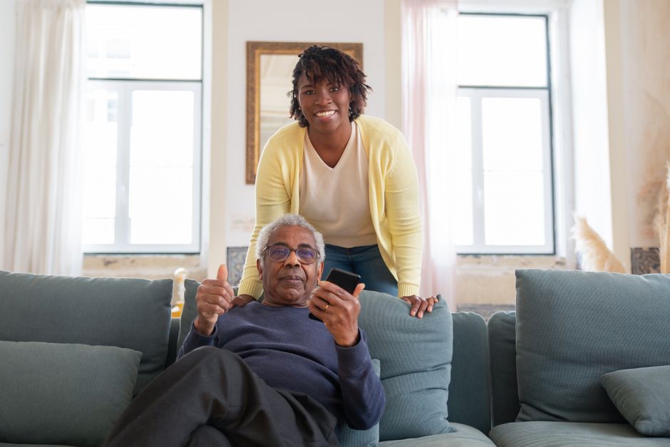 Caregiver sharing a joyful moment with a senior