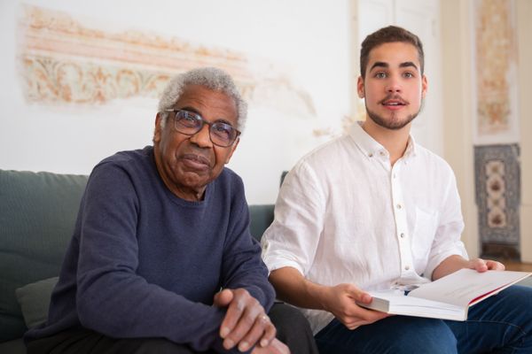 Nurse conducting personalized home care assessment with elderly client