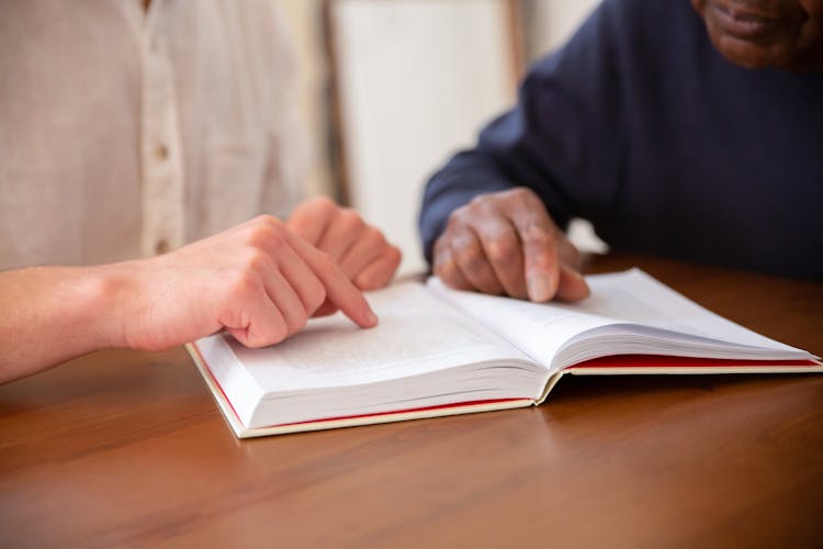 A Man Reading A Book