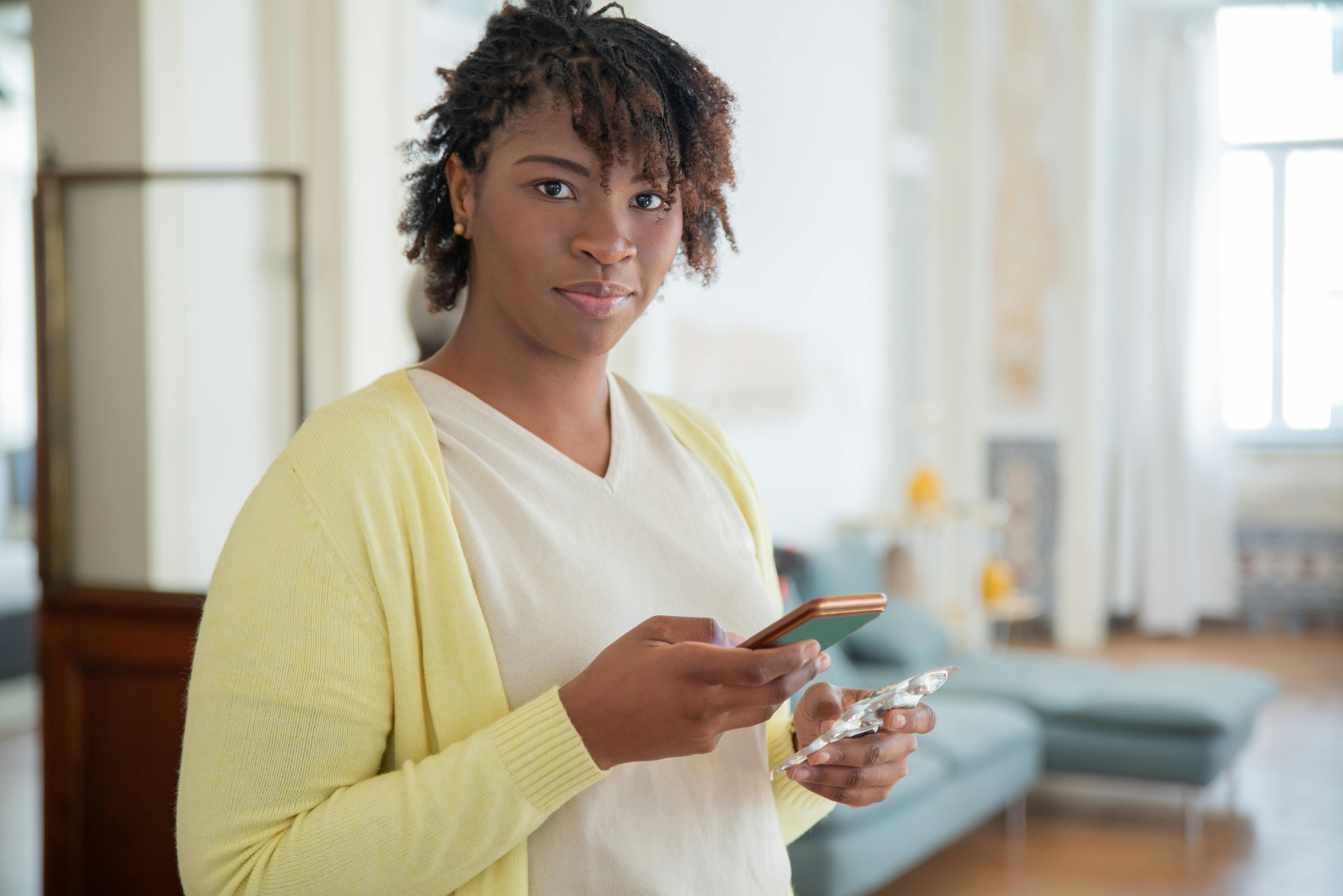 Older woman sitting alone looking thoughtful