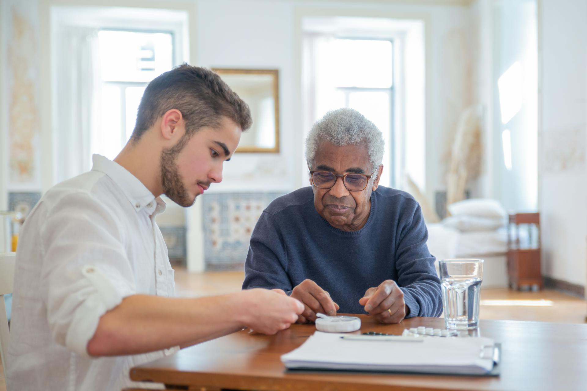 Young Man Helping Older Man