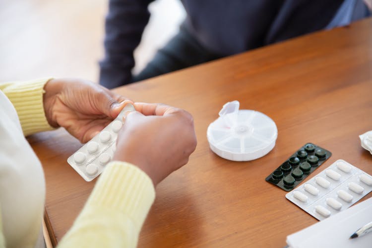 A Person Holding Medicines