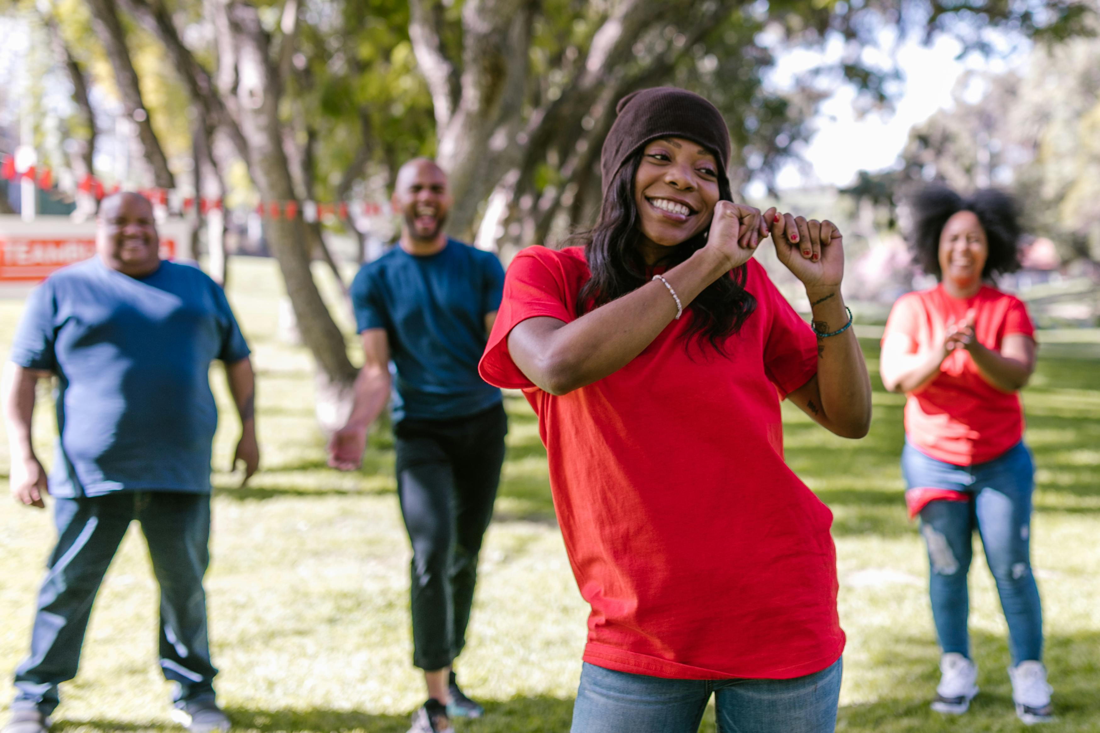 woman in red crew neck t shirt dancing