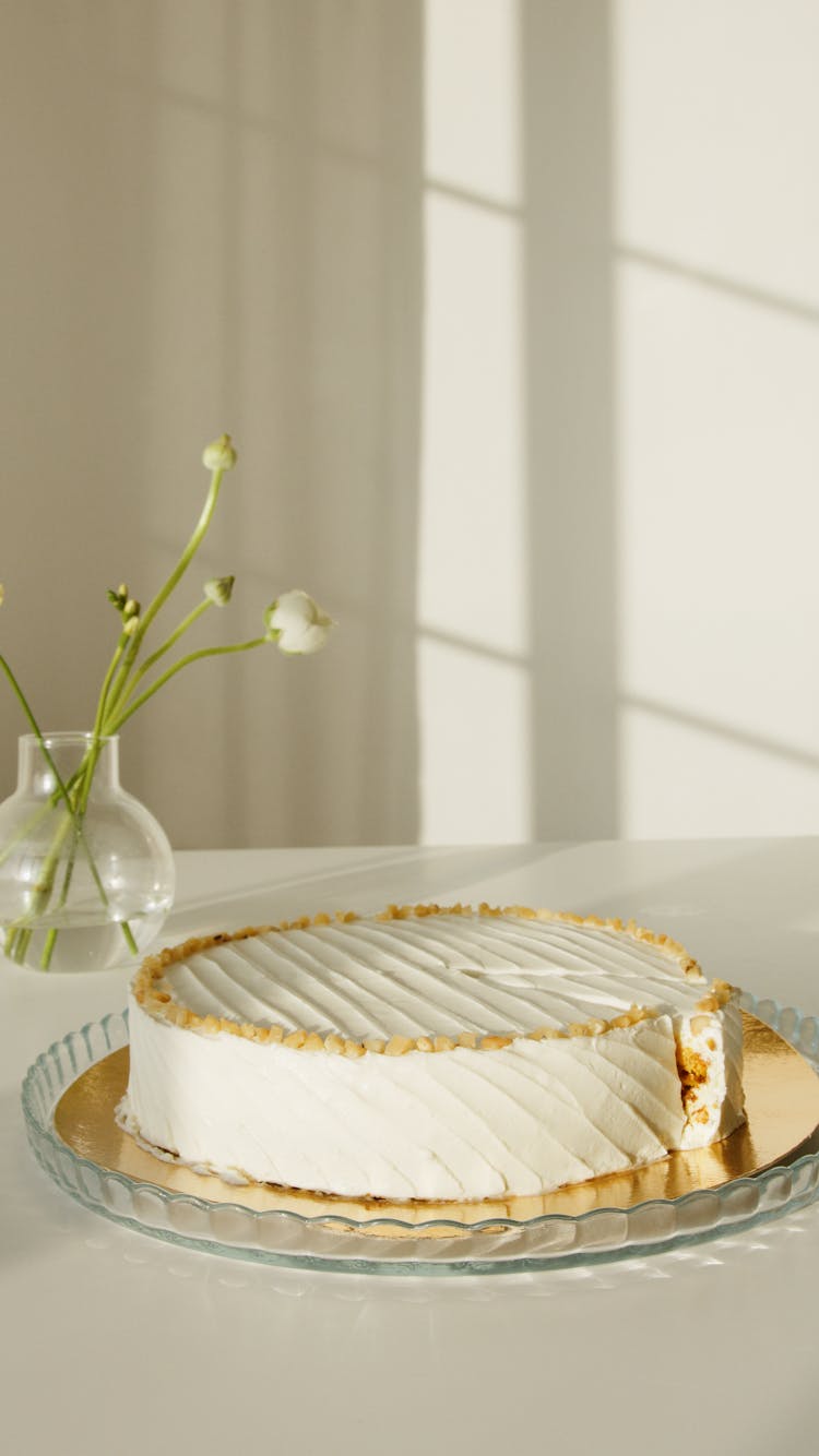 Photo Of A White Cake With Nuts