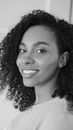 Grayscale Photo of Smiling Woman