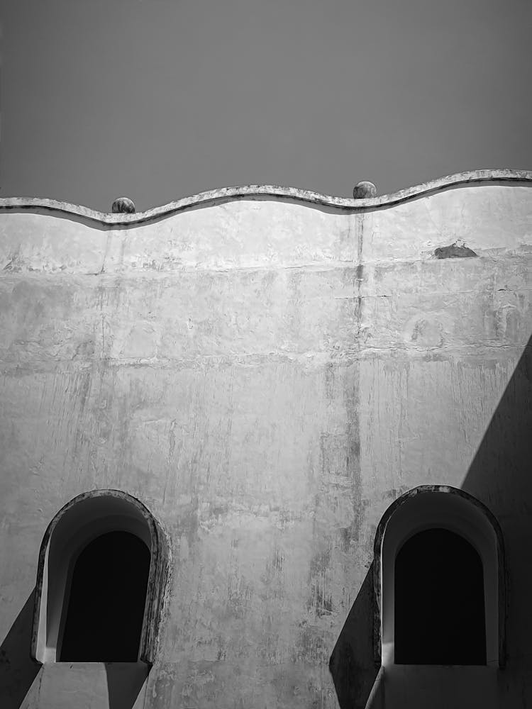 Black And White Photograph Of A Wave Shape Architecture Detail