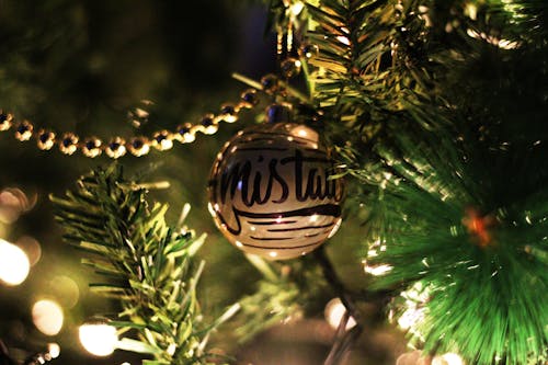 Free Gold Printed Bauble On Christmas Tree Stock Photo