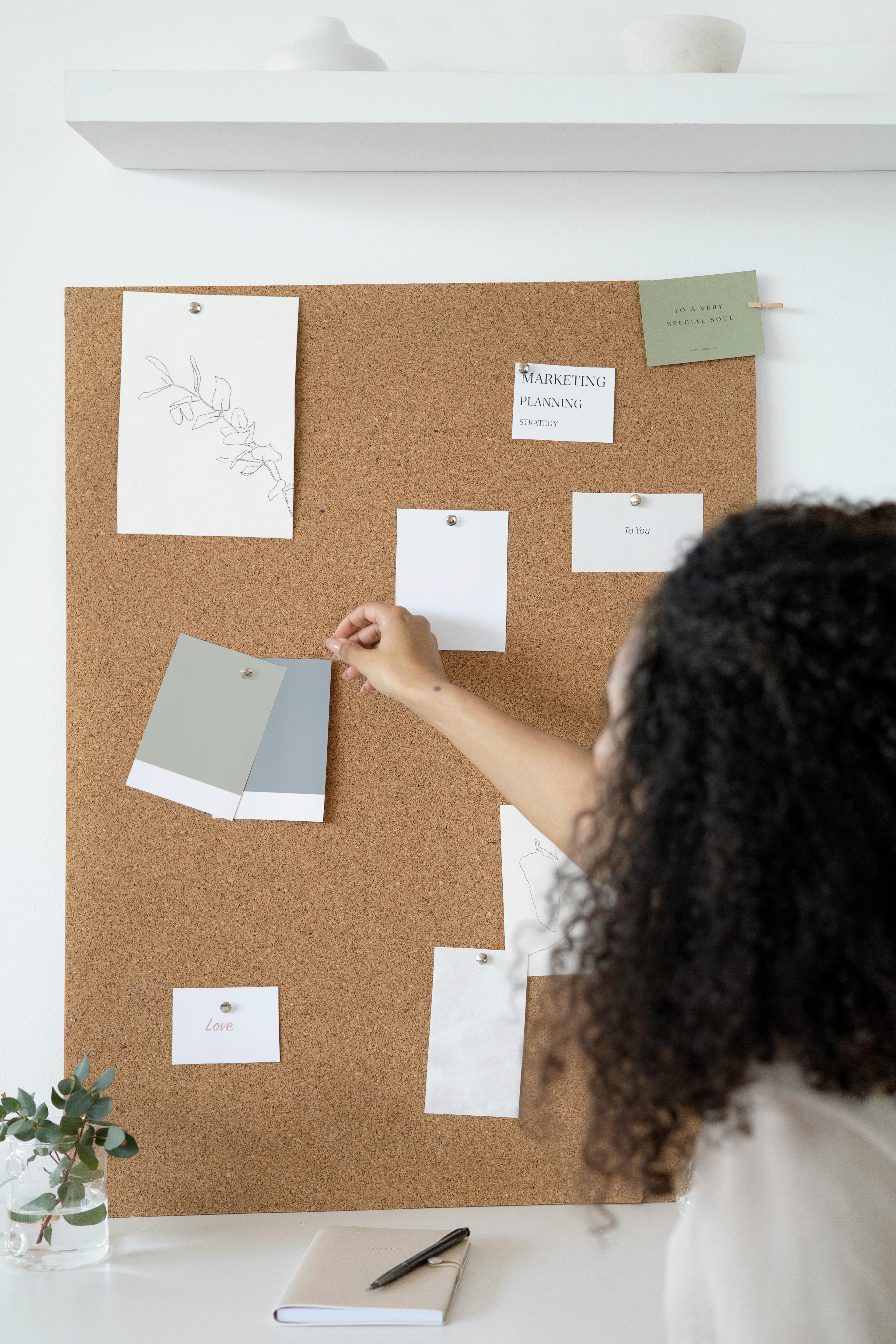 woman holding white printer paper