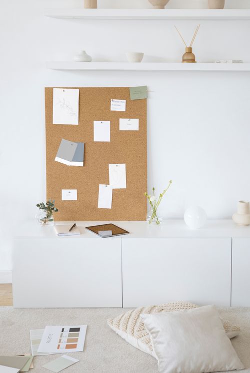 Free Bright and modern minimalist workspace with cork board for inspiration and creativity. Stock Photo