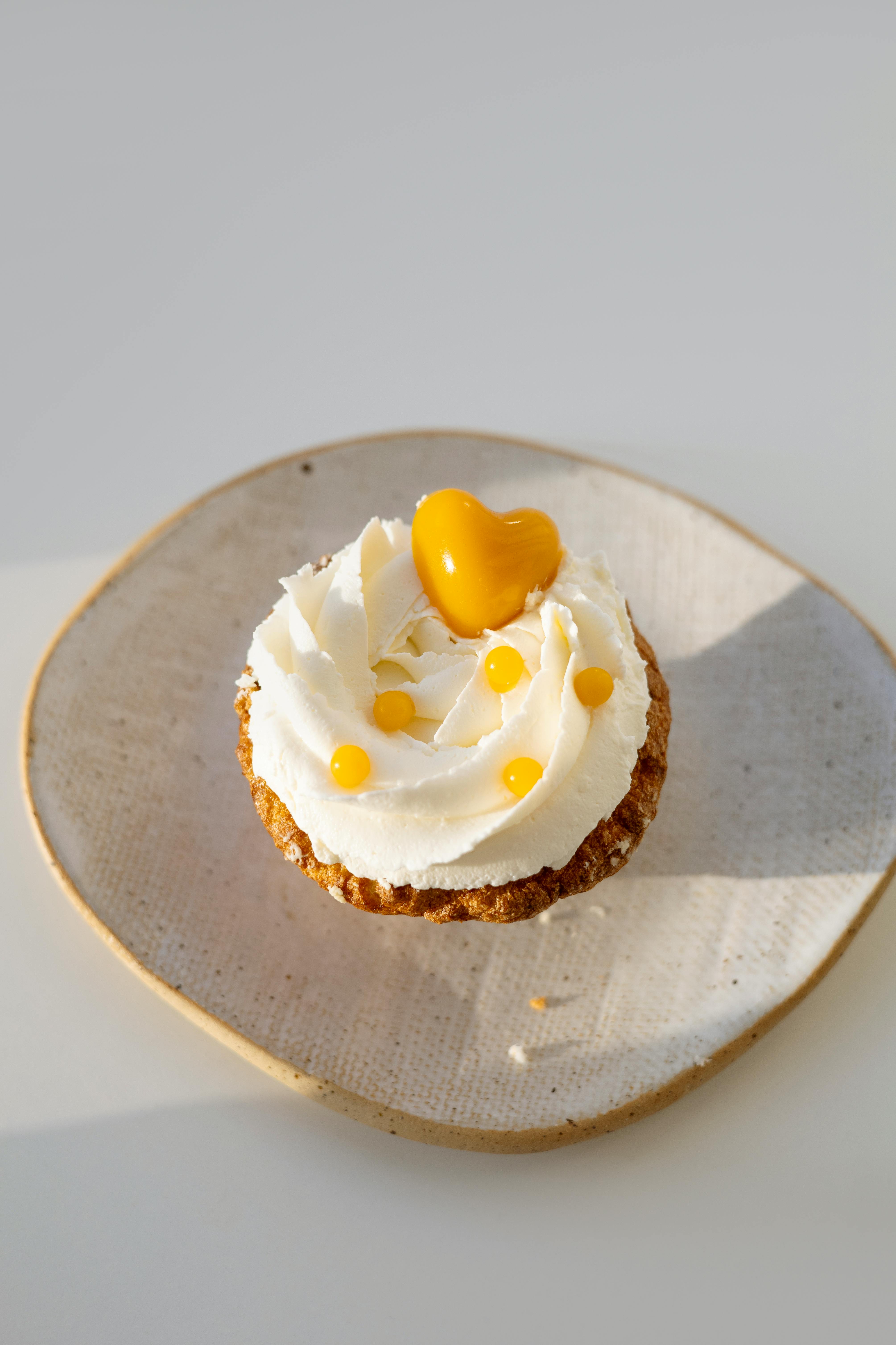 close up photo of a pastry with white cream