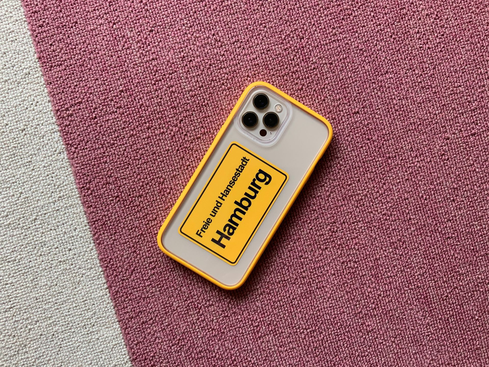 Phone in Transparent Case Lying on Carpet