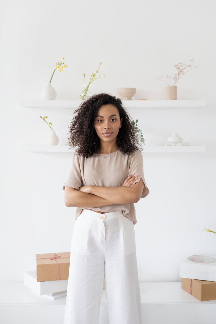 A Woman Posing And Smiling