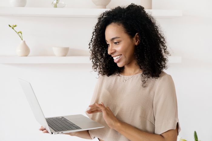 A woman using a laptop at home