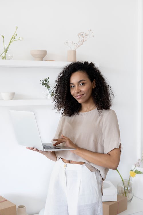 Woman in White Shirt Using Laptop Computer