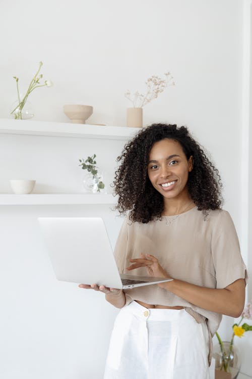 Smiling Woman Carrying Laptop 