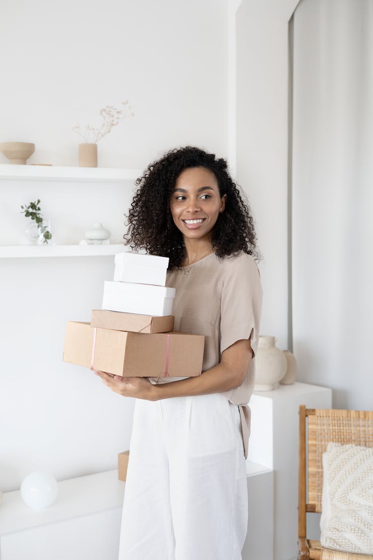 A Woman Holding Cardboard Boxes