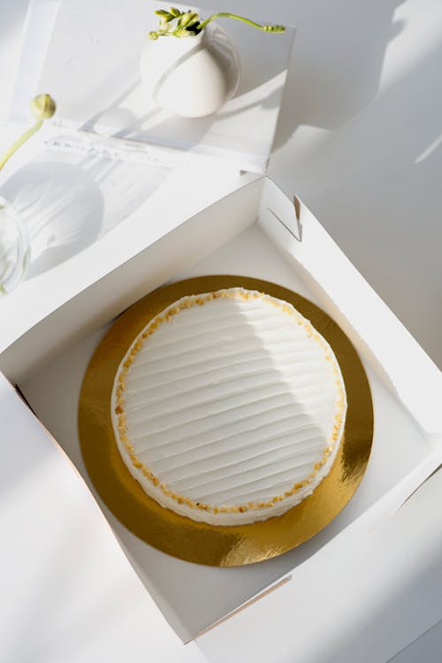 Gold and White Cake on White Box