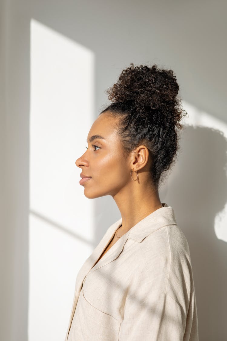 Side View Photography Of A Woman In Beige Shirt