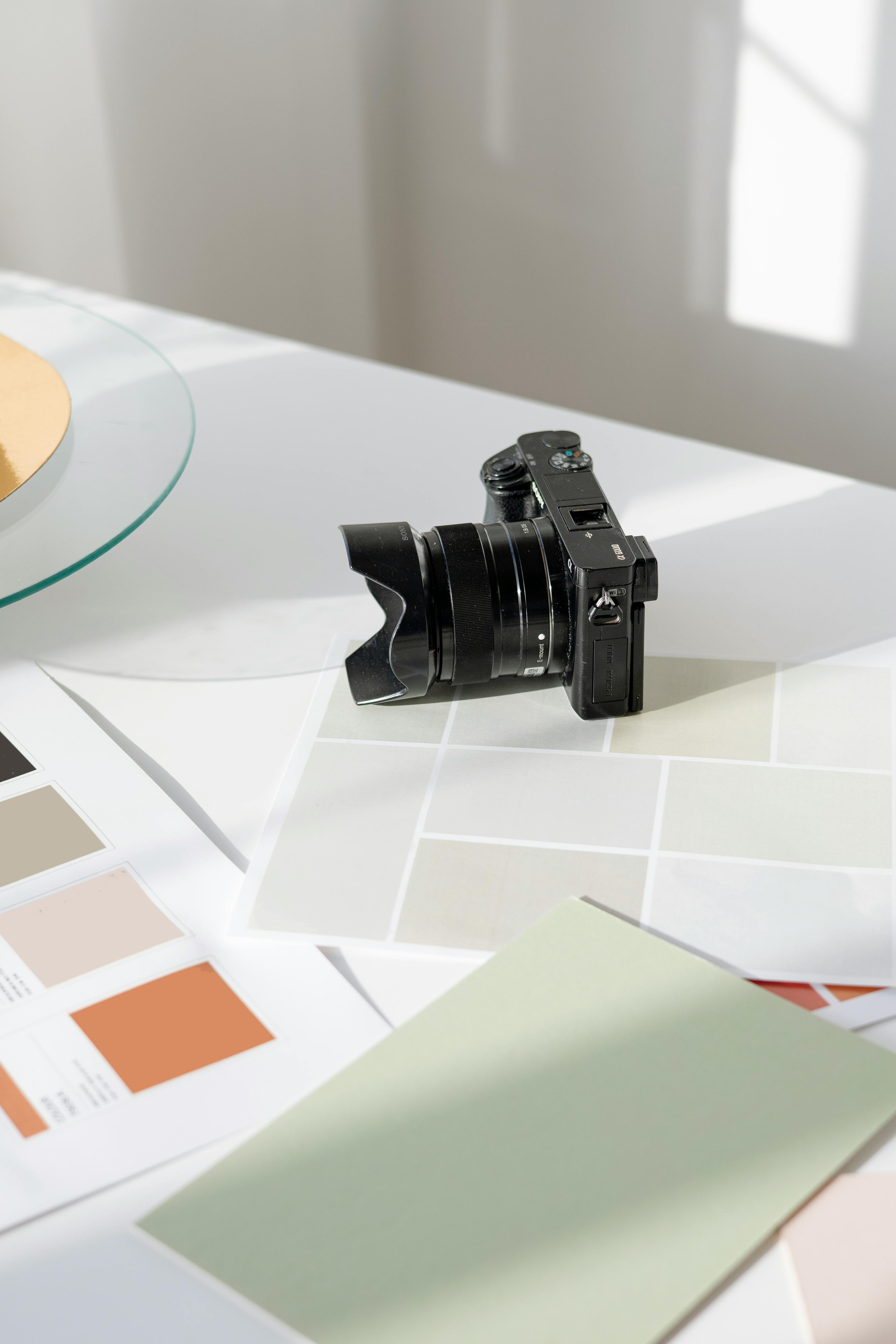 black dslr camera on white table