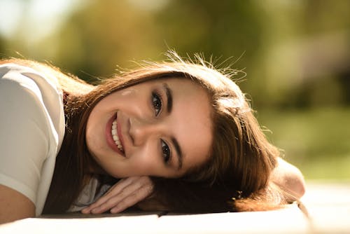 Free Close Up Photography of Woman Laying on Table Stock Photo