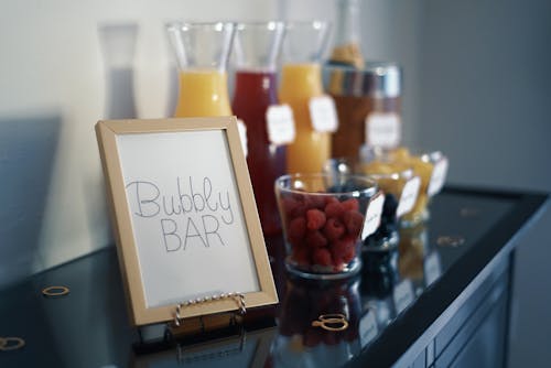 Free Brown Photo Frame Beside Drinking Glass With Fruit Inside Stock Photo