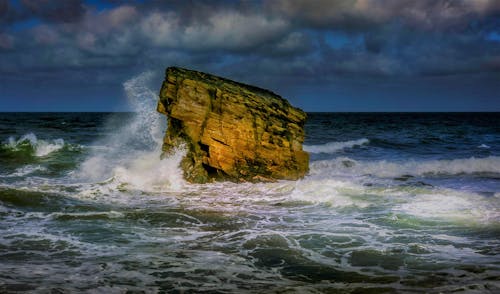 Wave over Rock on Sea Shore