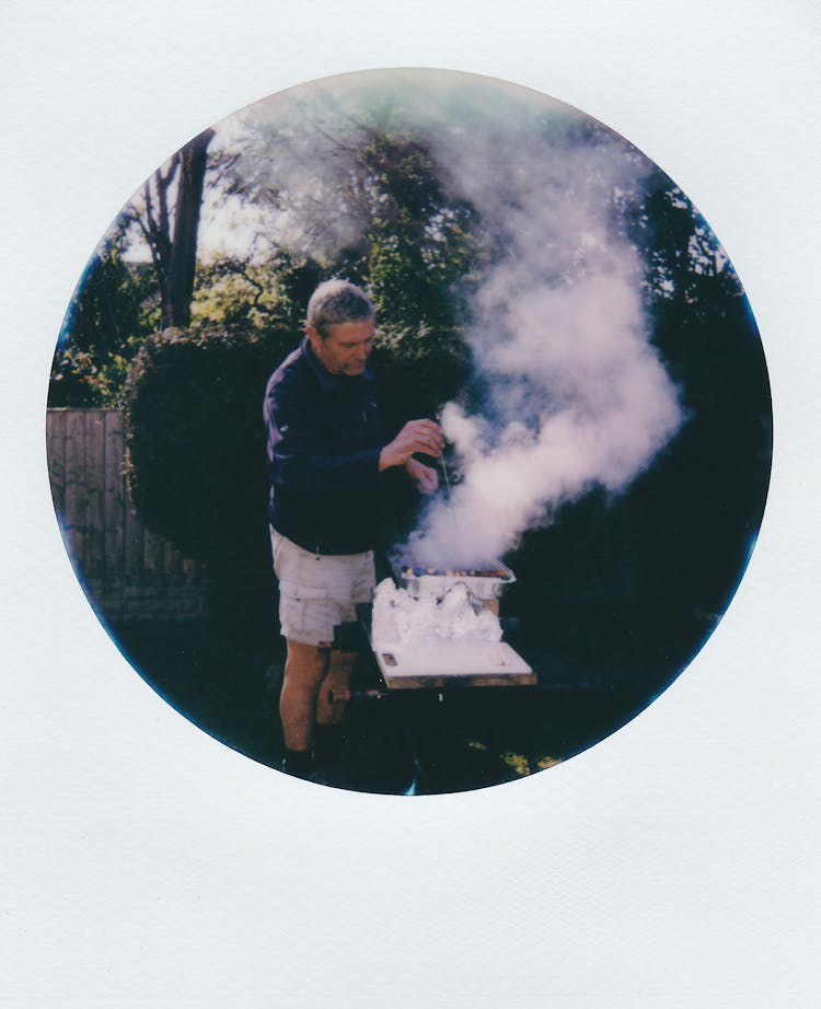 Oval Shape Photo Of A Man With Barbecue Smoke